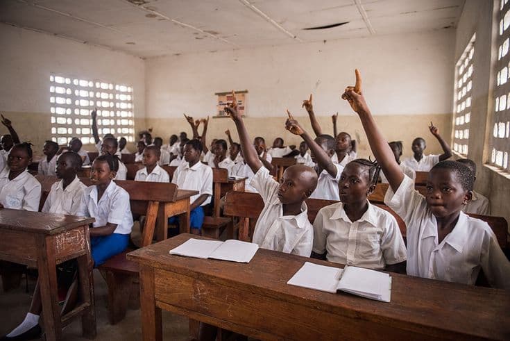 Learners taking part in a classroom discussion
