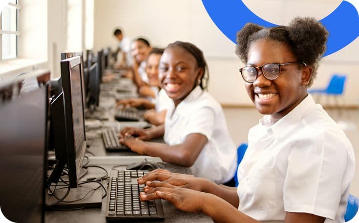 Learners working together in a school computer lab