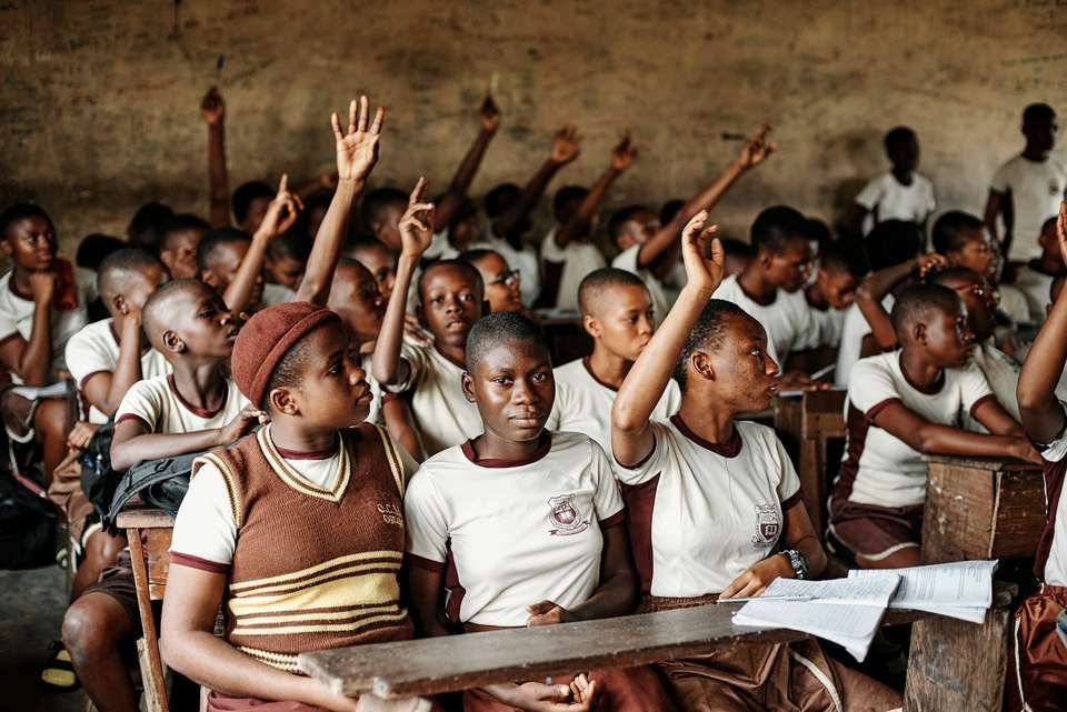 Secondary learners taking part in a classroom lesson